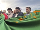 پرچم مقدس حضرت علی بن موسی الرضا (ع) در شهرستان ورامین به اهتزاز در آمد